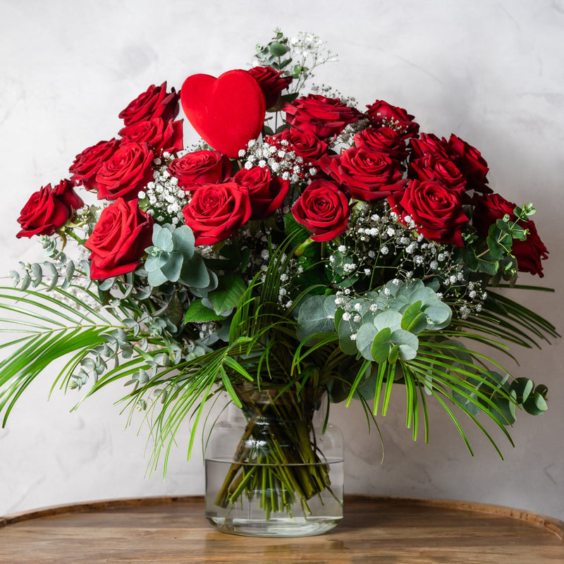 Full view of the Two Dozen Red Roses luxury bouquet with salal and eucalyptus foliage