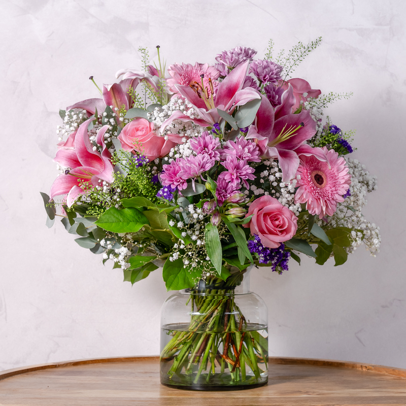 Full arrangement of Blooming Beautiful pink bouquet with eucalyptus and salal foliage available for same-day Dublin delivery