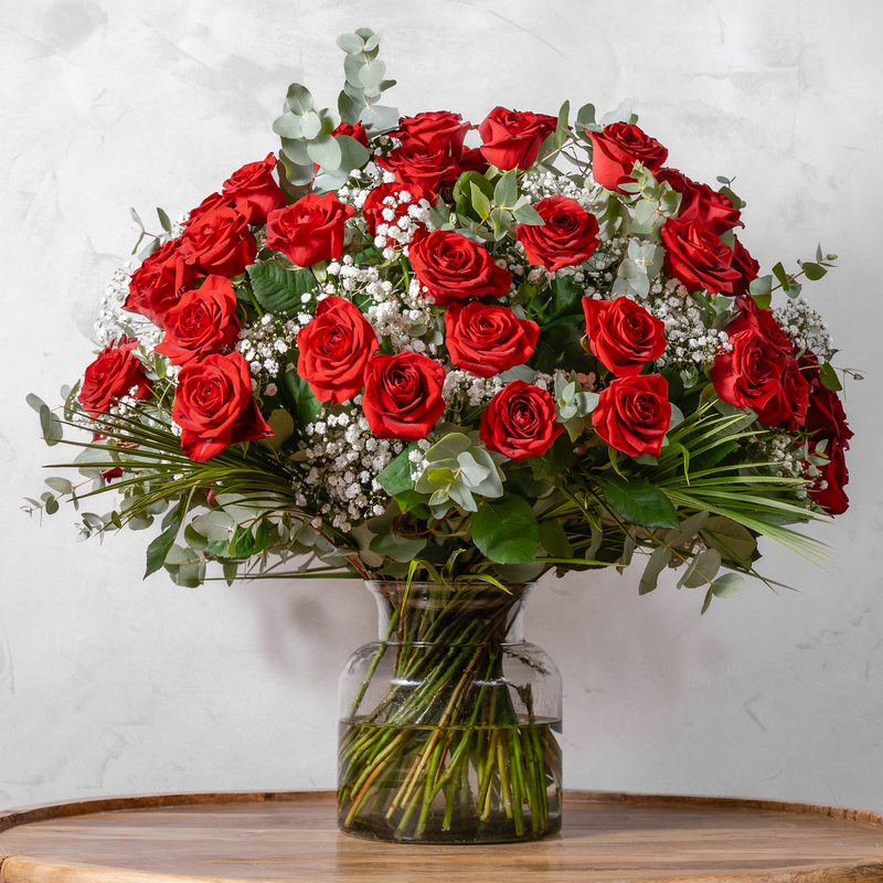Fifty Red Roses bouquet, fifty hand-tied red roses with gypsophila and seasonal greens