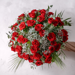 Close up of fifty hand-tied red roses with gypsophila in the Fifty Red Roses bouquet
