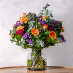 Full arrangement of Pop of Colour bouquet showing the vibrant mix of orange, purple and pink flowers available for same-day Dublin delivery