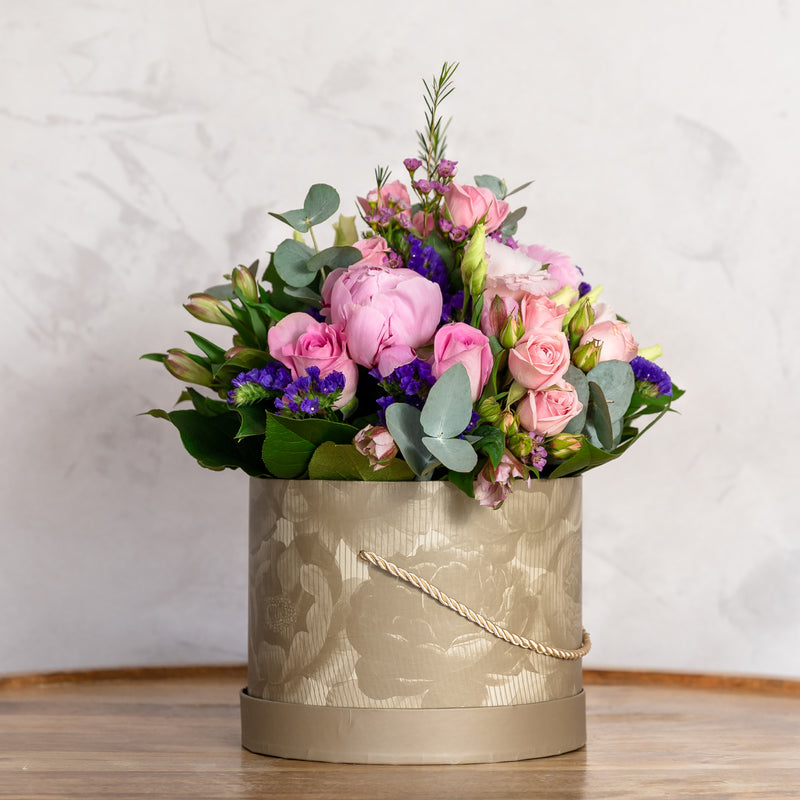 Top view of Peony Hatbox arrangement showing peony roses, statice and hypericum in a deluxe hatbox available for same-day Dublin delivery