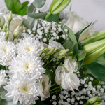 Full arrangement of Tranquility white flower bouquet with phoenix palm leaves and eucalyptus available for same-day Dublin delivery
