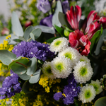 Wild and Wonderful wild flower bouquet side view showing natural burlap wrapping and seasonal foliage available for same-day Dublin delivery
