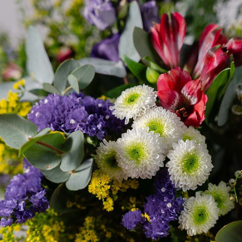 Wild and Wonderful wild flower bouquet side view showing natural burlap wrapping and seasonal foliage available for same-day Dublin delivery