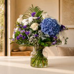 Blue Moon fresh flower bouquet with blue hydrangeas, white roses, purple lisianthus and statice hand-tied for delivery across Ireland
