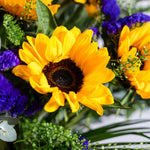 Close up of Sunflower Smile bouquet showing bold golden sunflower heads with camomile and eucalyptus available for same-day Dublin delivery