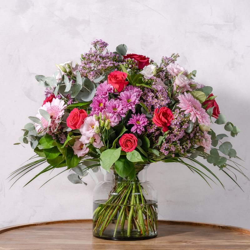 Full arrangement of Pretty in Pink bouquet showing vibrant pink flowers with salal and eucalyptus foliage available for same-day Dublin delivery