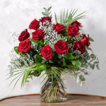 Full arrangement of Dozen Red Roses with phoenix palm leaves and salal foliage available for same-day Dublin delivery